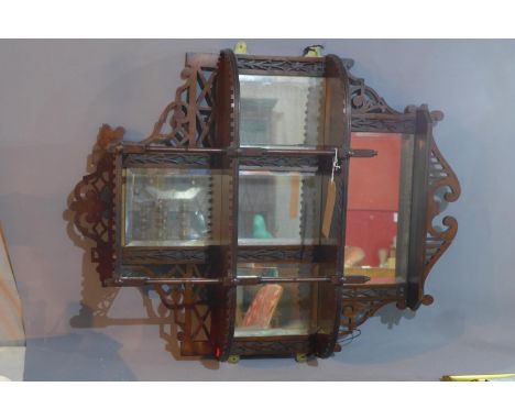 A Victorian mahogany mirrored back wall hanging shelf, with bevelled plates, 91 x 68cm 