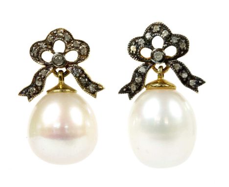 A pair of silver and gold cultured freshwater pearl and diamond earrings, a cultured freshwater pearl, cup set, to oxidised s