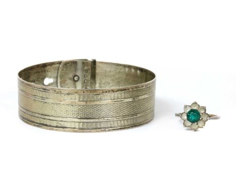 A sterling silver bangle, by Charles Horner, with engine turned decoration and buckle design fastening, Chester 1943, 19mm wi