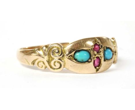 An Edwardian 9ct gold ruby and turquoise ring, a pair of round mixed cut rubies flanked either side by an oval cabochon turqu