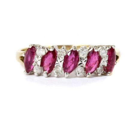 A 9ct gold ruby and diamond half eternity ring, a row of alternating marquise cut rubies and pairs of brilliant cut diamonds,