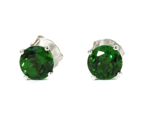 A pair of white gold single stone chrome diopside stud earrings, a circular mixed cut chrome diopside, 6mm, claw set to post 