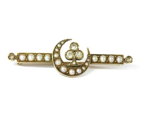 A late Victorian diamond and split pearl crescent brooch, a crescent grain set with a row of graduated split pearls, with a t