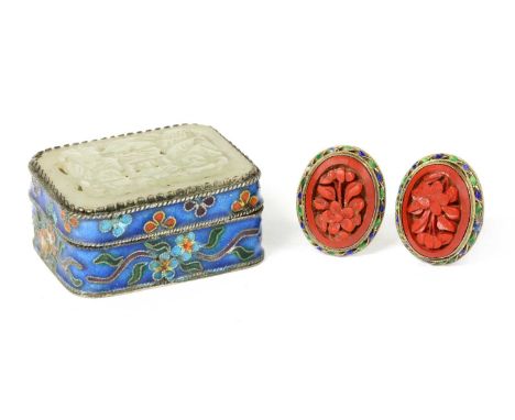 A pair of Chinese silver gilt cinnabar lacquer and enamel clip earrings, the lacquer carved with a floral bloom, to green and