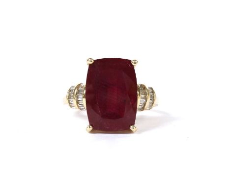 A gold fracture filled ruby and diamond ring, a cushion cut fracture filled ruby, approximately 14.03 x 9.88 x 6.27mm, claw s