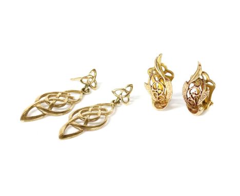 A pair of 9ct gold pierced clip earrings, London, 8.5mm long, together with a pair of 9ct gold openwork Celtic design drop ea