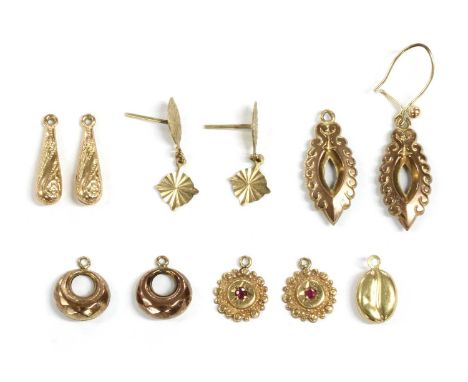 A quantity of gold fittings, to include a pair of patterned pippin drops, a pair of faceted circular drops, a pair of circula