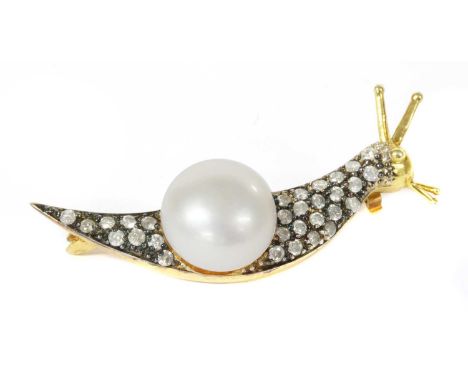 A silver cultured freshwater pearl and diamond snail brooch, the brooch in the form of a snail, with a cultured freshwater pe