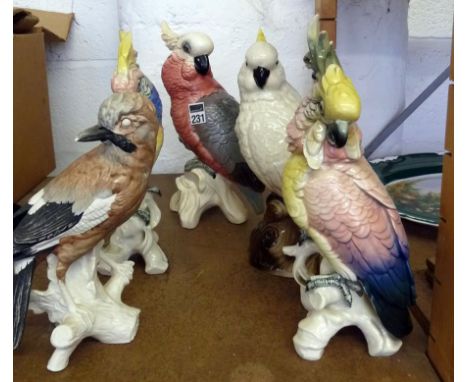 Goebel figure of a woodpecker & 4 other continental type parrot ornaments