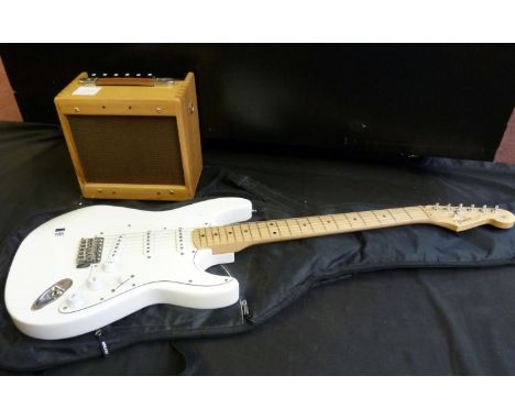 Fender Stratocaster electric guitar in white with practice amplifier