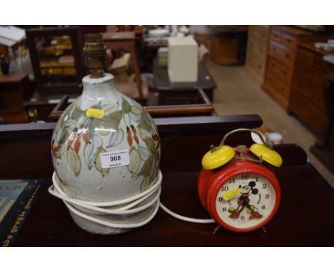 A pottery table lamp base and a Micky Mouse alarm clock 