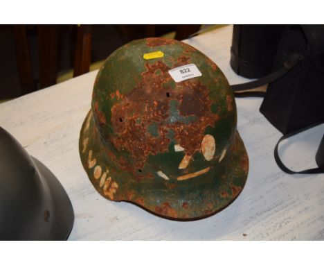 A German WW2 battlefield find helmet with inscription around edge in French 