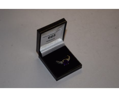 A silver gilt and amethyst set ring 