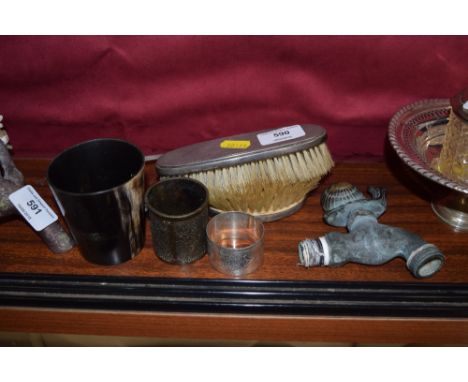 Two silver backed dressing table brushes; together with a silver serviette ring; a horn beaker; a tap mounted with a snail et