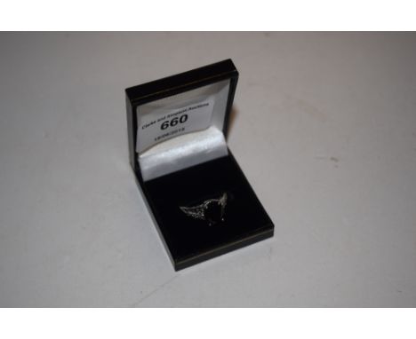 A silver and black spinel set ring 