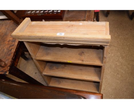 A stripped pine wall shelf fitted two drawers 