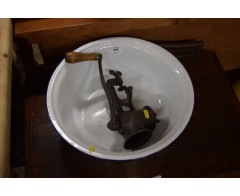 A mincer and an enamel bowl 
