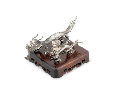 A CHINESE EXPORT SILVER DRAGON MENU HOLDER BY WANG HING & CO.,HONG KONG, CANTON & SHANGHAI (WH, 85 CHOP MARK, 85) FL. CIRCA 1