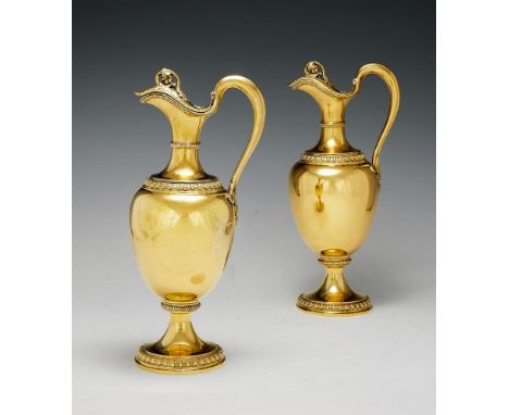 A PAIR OF VICTORIAN SILVER GILT OVOID CLARET JUGS BY GARRARD & CO. LONDON 1856 Stamped for R. & S. Garrard as retailers, with