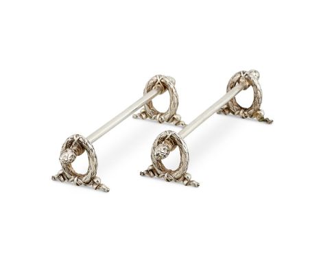 FABERGÉ, A PAIR OF RUSSIAN SILVER KNIFE RESTS BY KARL FABERGÉMOSCOW 1908-17The plain bars with cone terminals, on oval wreath