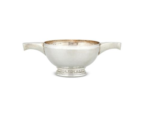 AN ARTS AND CRAFTS HAMMERED SILVER QUAICHE BY OMAR RAMSDENLONDON 1927Engraved Omar Ramsden me fecit, plain, on a moulded coll