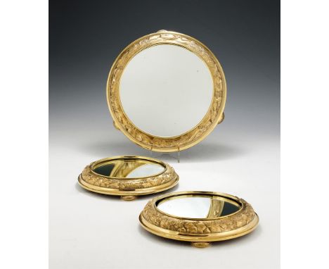 A VICTORIAN SCOTTISH SILVER GILT SUITE OF THREE MIRROR PLATEAUX BY GEORGE EDWARD & SONSGLASGOW 1879Chased with a boulder stre