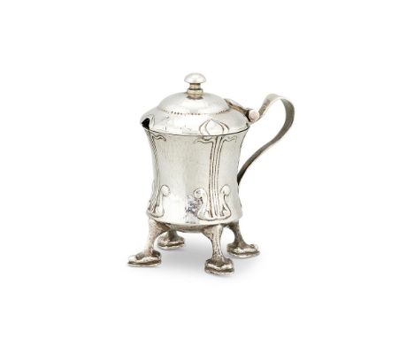 AN ARTS AND CRAFTS HAMMERED 'CYMRIC' SILVER MUSTARD POT BY LIBERTY & CO.  BIRMINGHAM 1903No. 409, designed by Archibald Knox,