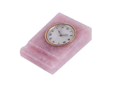 A ROSE QUARTZ MOUNTED ALARM CLOCK BY EUROPEAN WATCH & CLOCK CO. INC CIRCA 1920 The silvered engine turned dial with black Rom