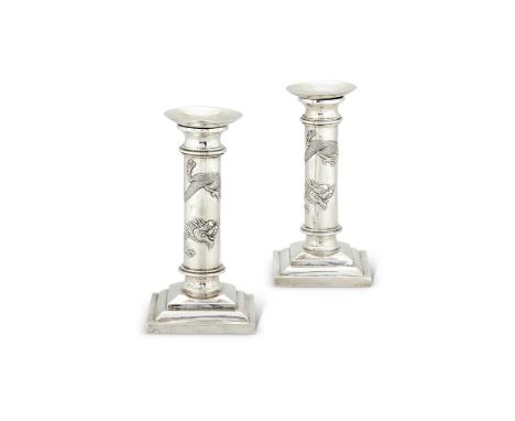 A PAIR OF CHINESE EXPORT SILVER CANDLESTICKS BY WANG HING & CO.HONG KONG, CANTON & SHANGHAI (WH,90) FL. CIRCA 1854-1941, CIRC