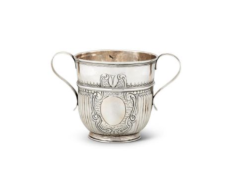 A QUEEN ANNE SILVER TWIN HANDLED CUP BY JOHN WISDOMELONDON 1705BRITANNIA STANDARDWith moulded S-scroll handles, straight flut