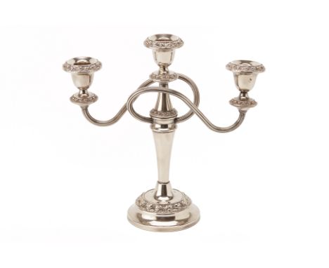 A SILVER PLATED THREE LIGHT CANDELABRUM
Mid 20th C., with reeded scrolling branches and foliate borders
26cm high
Condition: 
