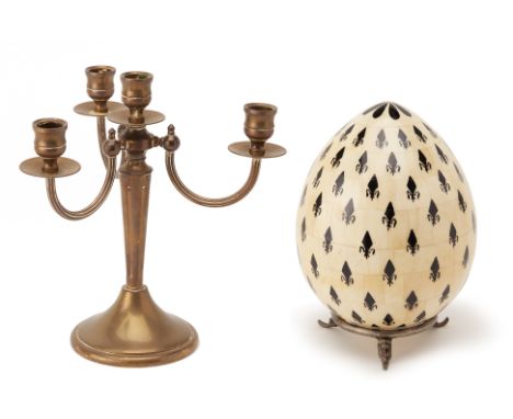 A BONE MODEL OF AN EGG AND A FOUR LIGHT CANDELABRUM
The egg, on a triform base, formed of bone panels with fleur de lys decor