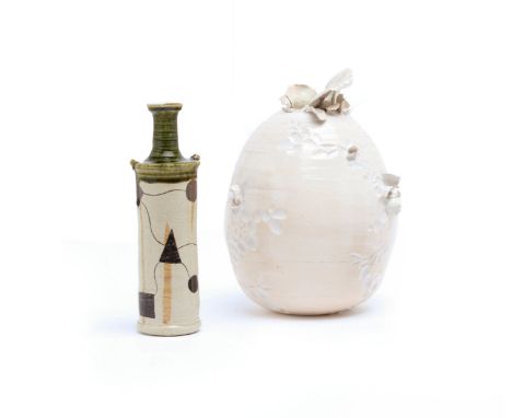 TWO STUDIO CERAMIC VASES
Comprising of a cylindrical shaped vase, indistinctly signed to the base, and a bulbous cream vase w