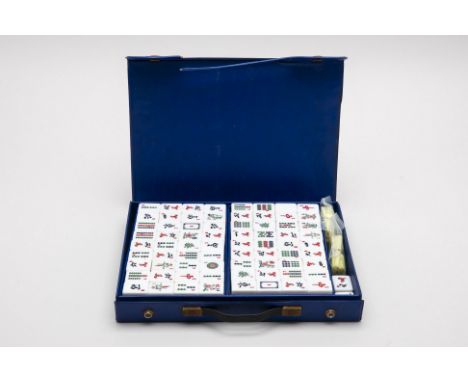 A RESIN MAHJONG SET
Housed in a blue plastic case
Case measures 34cm x 26cm
Condition: Minor signs of wear commensurate with 