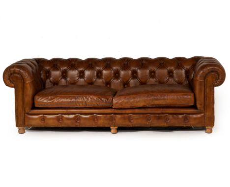 A TIMOTHY OULTON LEATHER CHESTERFIELD TYPE SOFA
With button upholstered backs and arms
74cm high x 238cm long x 86cm wide
Con