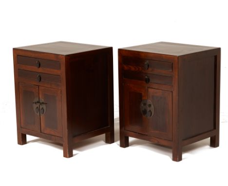 A PAIR OF CHINESE BEDSIDE CABINETS
With two drawers above a pair of cupboard doors, both with pins
60cm high x 45cm wide x 40