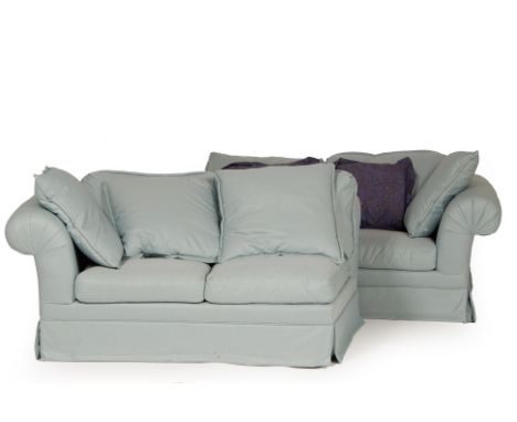 A LARGE BLUE UPHOLSTERED FOUR SEATER SOFA
In two sections, with scroll arms and loose cushions
Each separate 73cm x 126cm x 1