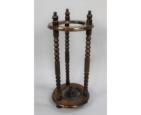 A Circular Stick Stand with Three Tuned Bobbin Supports, 31cms Diameter and 71cms High 