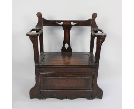 An Edwardian Oak Hall Seat and Stick Stand with Hinged Lid and Pierced Top Rail, 76cms Wide 