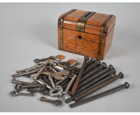 An Edwardian Brass Bound Oak Money Box in the Form of a Travelling Trunk Containing Various Cabinet and Door Keys Etc, 10.5cm