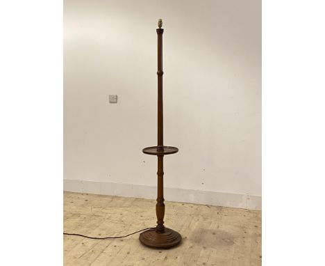 A turned mahogany stand light, with open shelf and stepped circular base H166cm