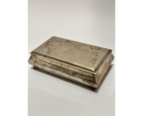 A rectangular white metal presentation cigarette box presented to N W Stuart by Boots Pure Drug Company Pakistan Ltd December