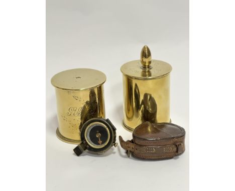 A pair of cut down WWI shell cases with engraved panel to front with initials JVJFG with flower decoration, the other with sh