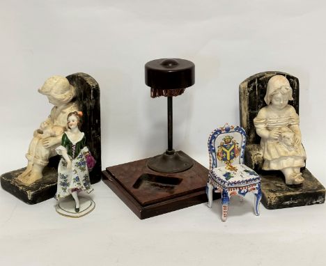 A pair of 1920s plaster cast seated boy and girl figure bookends, a/f, distressed, (17cm x 13cm), a modern china foreign porc