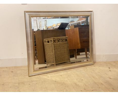 A silvered and gilt framed wall mirror with bevel edge 92cm x 118cm