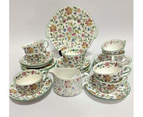 A Minton Haddon Hall pattern part piece tea set with floral sprays and gilt border including seven tea cups, sugar basin, mil