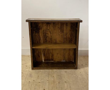 An early 20th century oak open bookcase, with floral carved bands and one adjustable shelf, H82cm, W84cm, D24cm