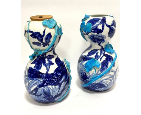 A pair of ceramic double gourd shaped china vases in the Minton style, with handpainted bird and peony design, with scrolling