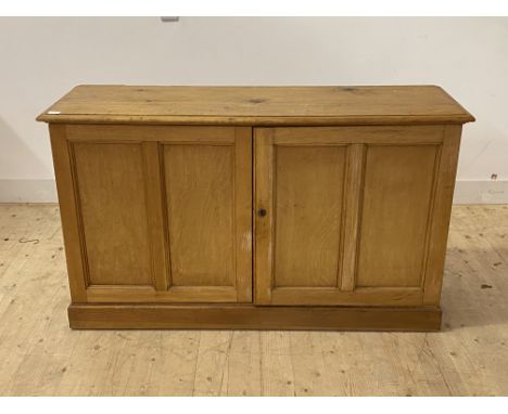 A Victorian and later pine side cabinet, the twin doors enclosing a shelf, on skirted base, H85cm, W144cm, D46cm