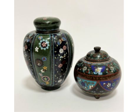 A Chinese white metal Cloisonne tapered tea caddy complete with inner lid and cover, decorated with green and blue panels wit